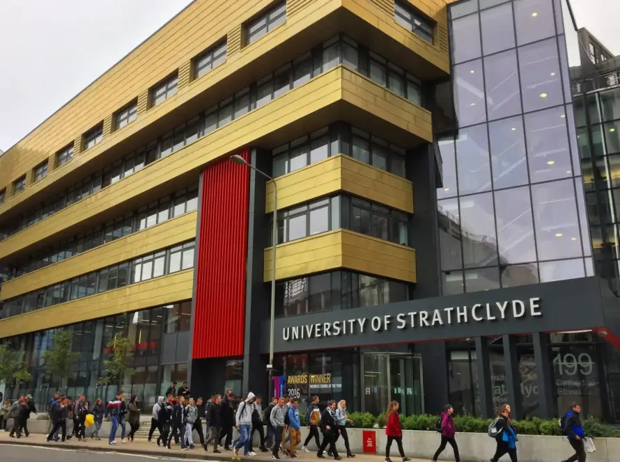 People walking by the University of St George's building near Strathclyde Business School.